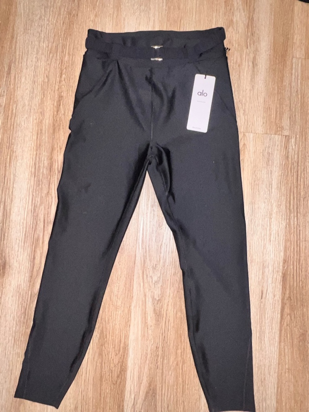 ALO Yoga Black High-Rise Performance Leggings with Tag with a front BUCKLE